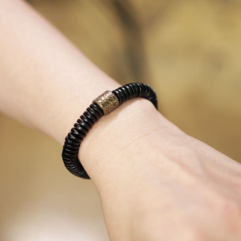 Matte Ebony Wood Roller Bead Bracelet with Brass and Copper Accents