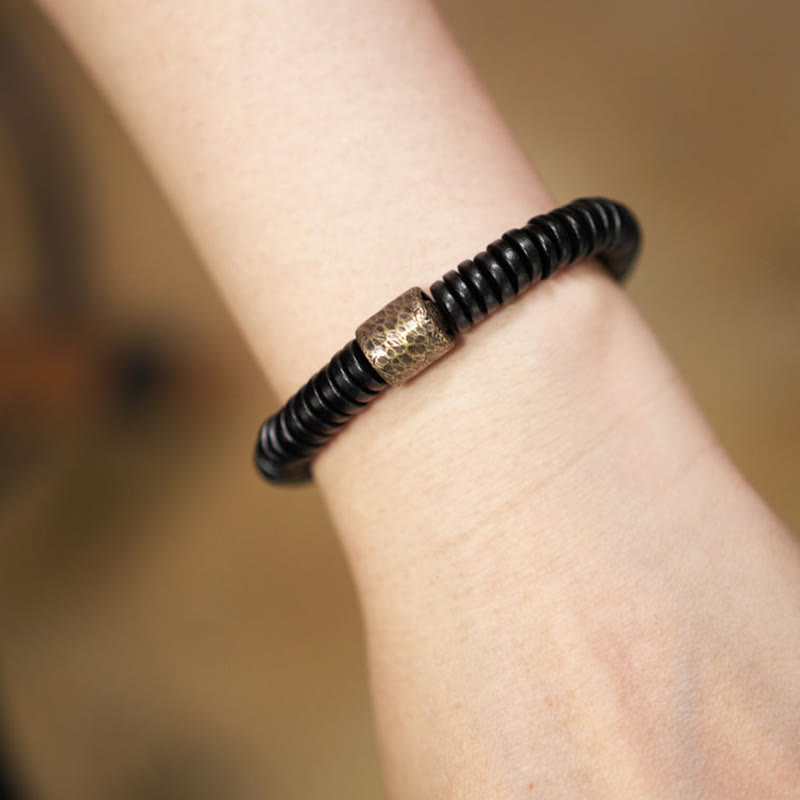 Matte Ebony Wood Roller Bead Bracelet with Brass and Copper Accents
