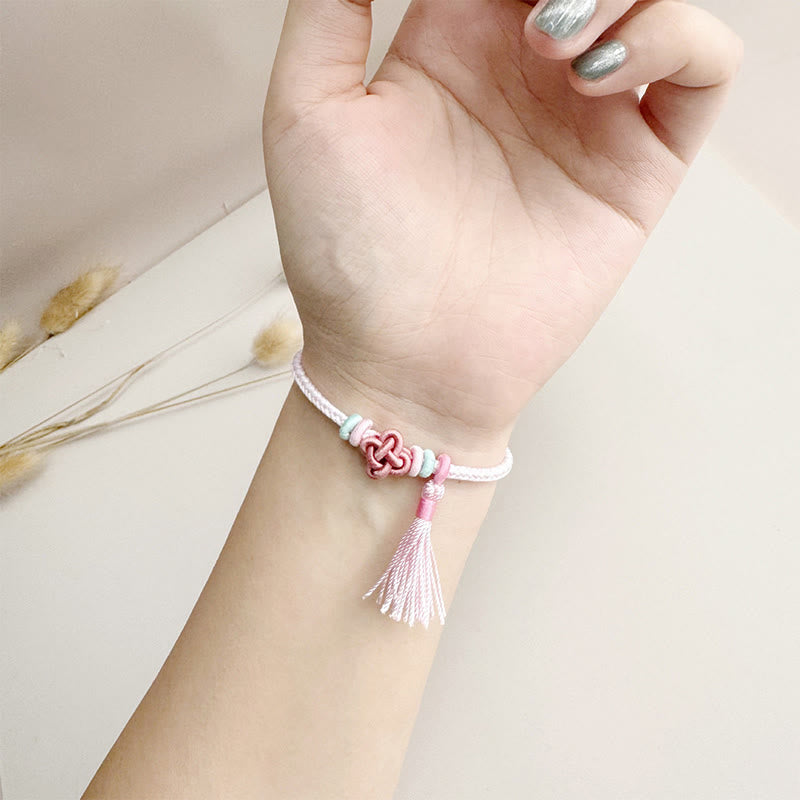 Handmade Endless Knot Tassel Bracelet with Peach Blossom Cord
