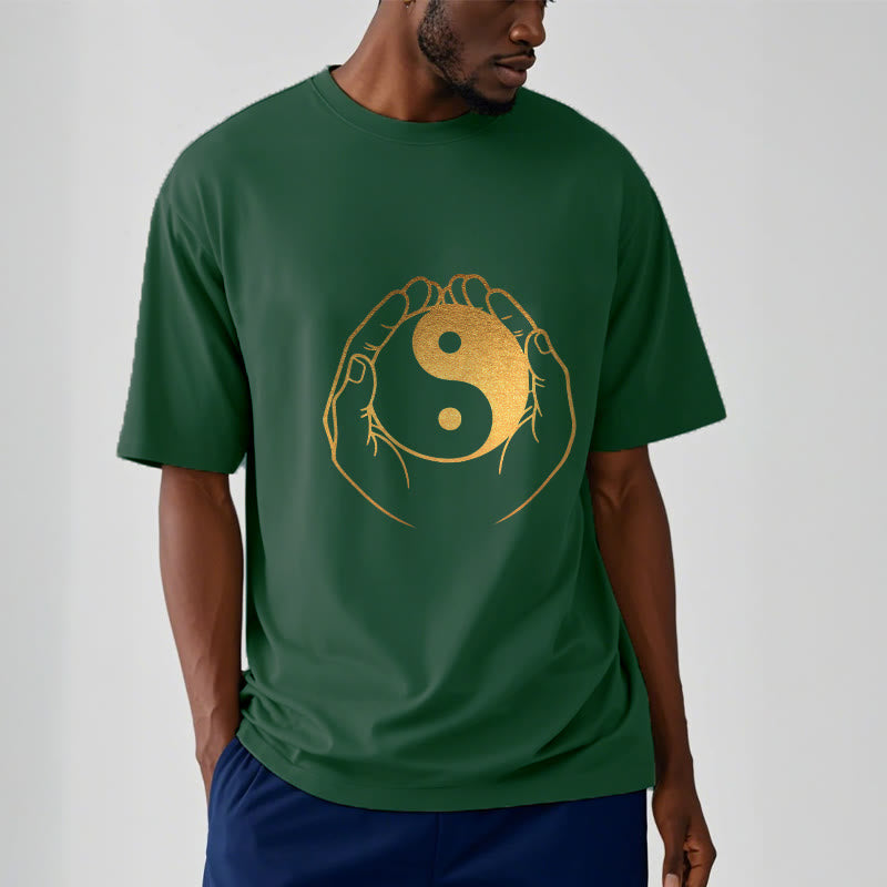 Hands Holding A Golden Yin Yang Tee T-shirt