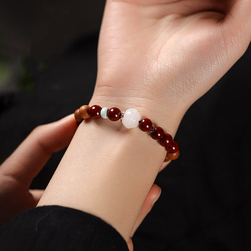 Handcrafted Sandalwood and Cinnabar Beaded Bracelet with Lotus or Fu Charm