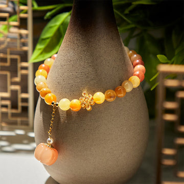 Handmade Golden Silk Jade Pumpkin Bead Bracelet with Copper Endless Knot