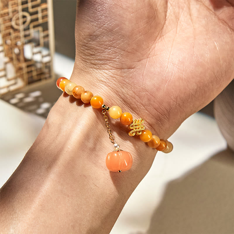 Handmade Golden Silk Jade Pumpkin Bead Bracelet with Copper Endless Knot