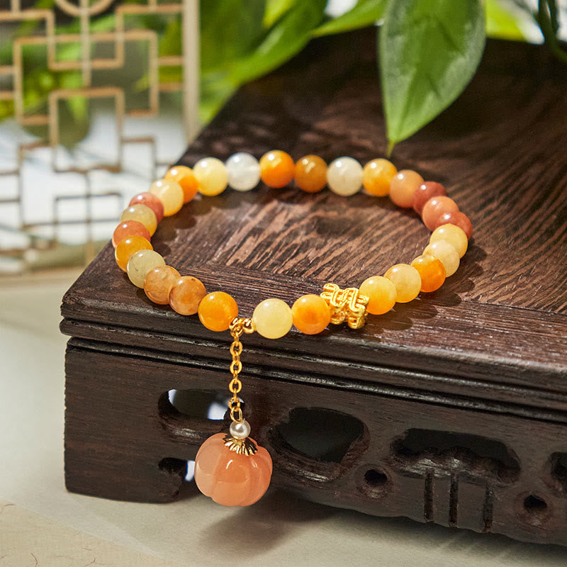 Handmade Golden Silk Jade Pumpkin Bead Bracelet with Copper Endless Knot