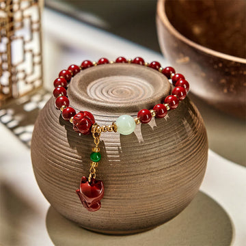 Cinnabar and Jade Lotus Fox Charm Copper Accent Bracelet