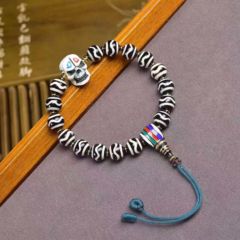 Tibetan Braided Cord Bracelet with Copper Citipati and Dzi Bead