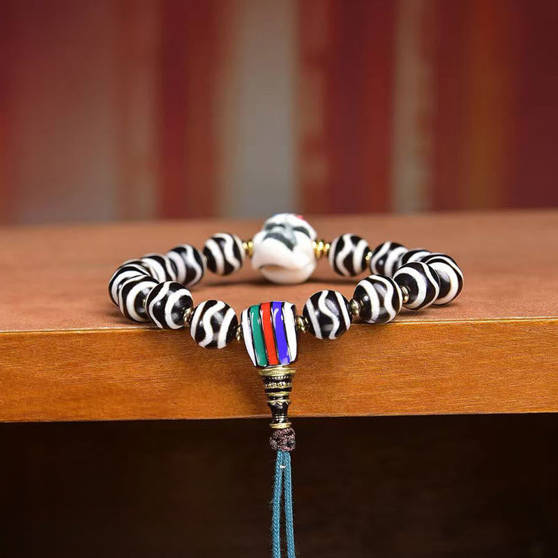 Tibetan Braided Cord Bracelet with Copper Citipati and Dzi Bead