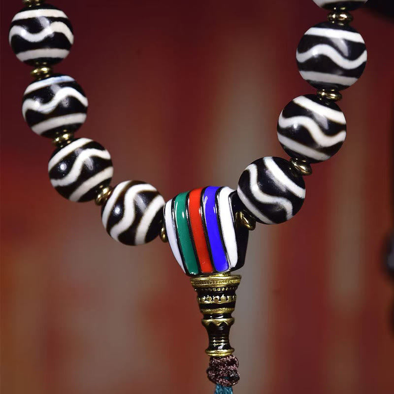 Tibetan Braided Cord Bracelet with Copper Citipati and Dzi Bead