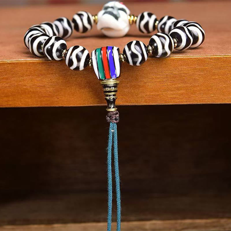 Tibetan Braided Cord Bracelet with Copper Citipati and Dzi Bead
