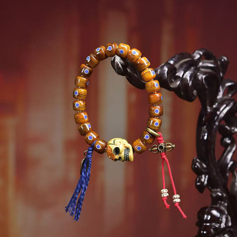 Tibetan Bone Bead Bracelet with Copper Citipati Skull Accents