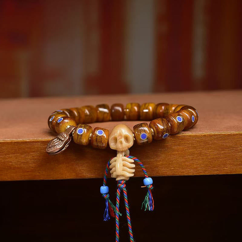 Tibetan Bone Bead Bracelet with Copper Citipati Skull Accents