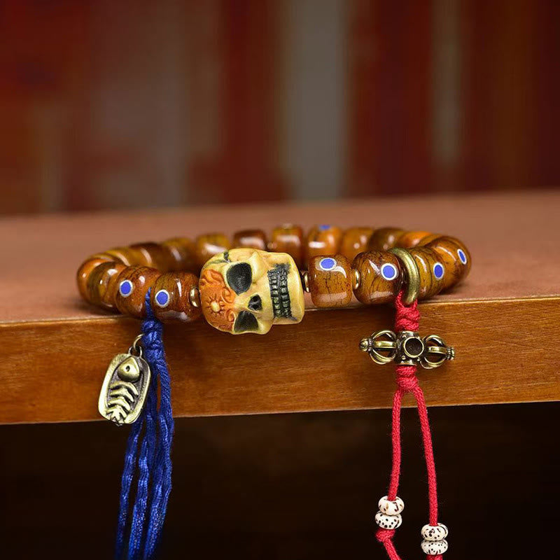 Tibetan Bone Bead Bracelet with Copper Citipati Skull Accents