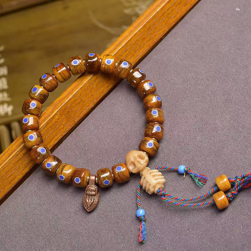 Tibetan Bone Bead Bracelet with Copper Citipati Skull Accents