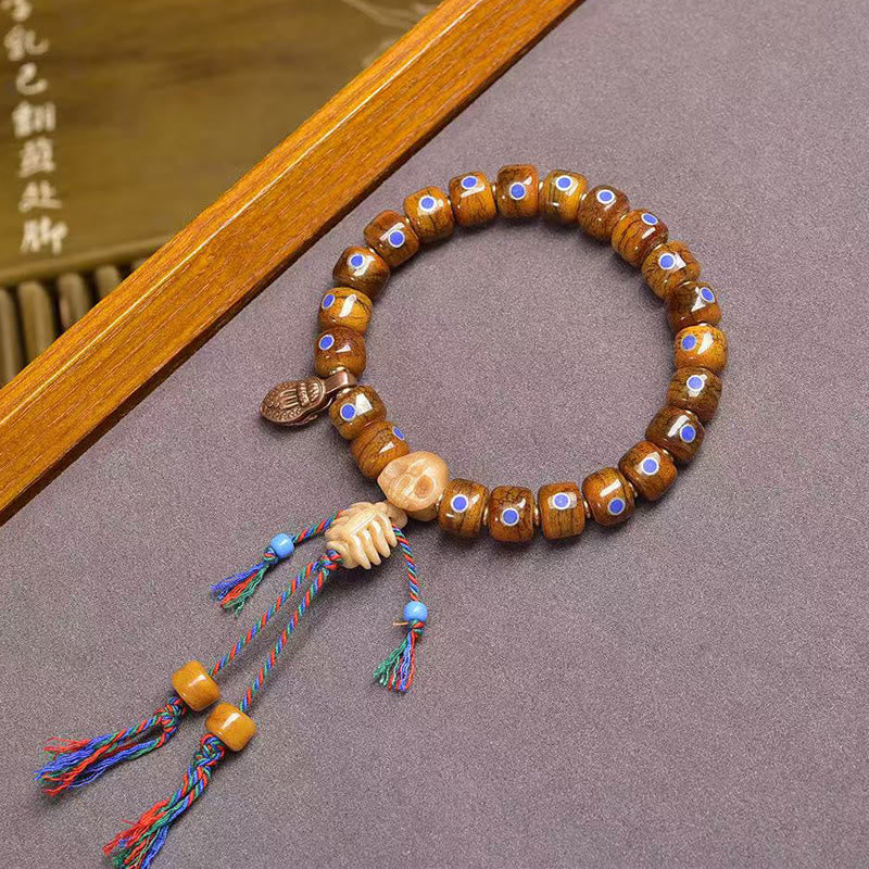 Tibetan Bone Bead Bracelet with Copper Citipati Skull Accents