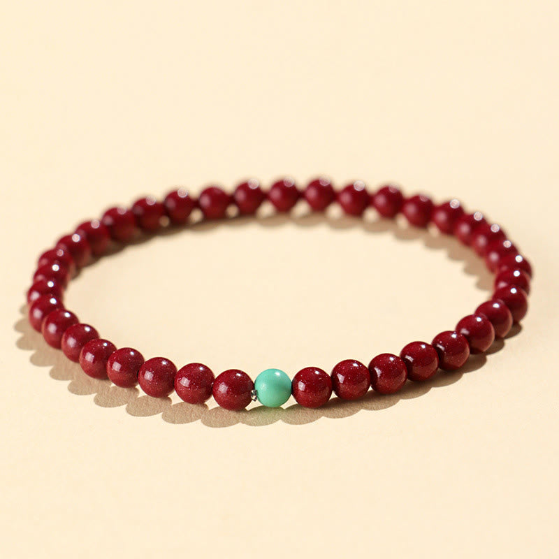 Handmade Cinnabar and Turquoise Lotus Symbol Beaded Bracelet