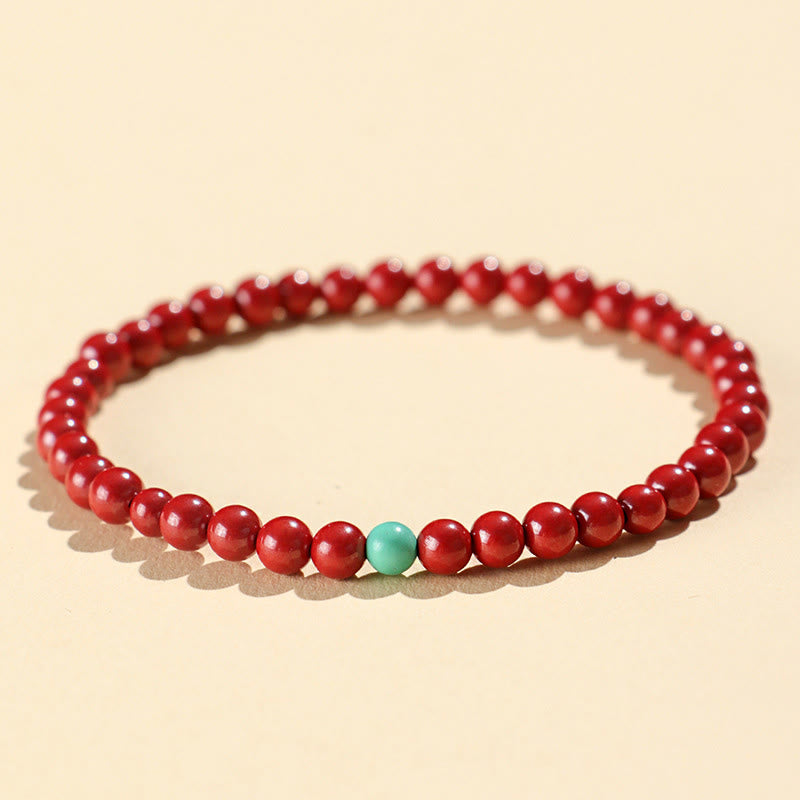 Handmade Cinnabar and Turquoise Lotus Symbol Beaded Bracelet