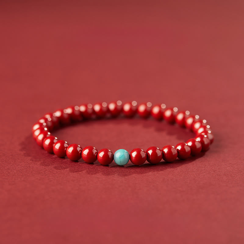 Handmade Cinnabar and Turquoise Lotus Symbol Beaded Bracelet