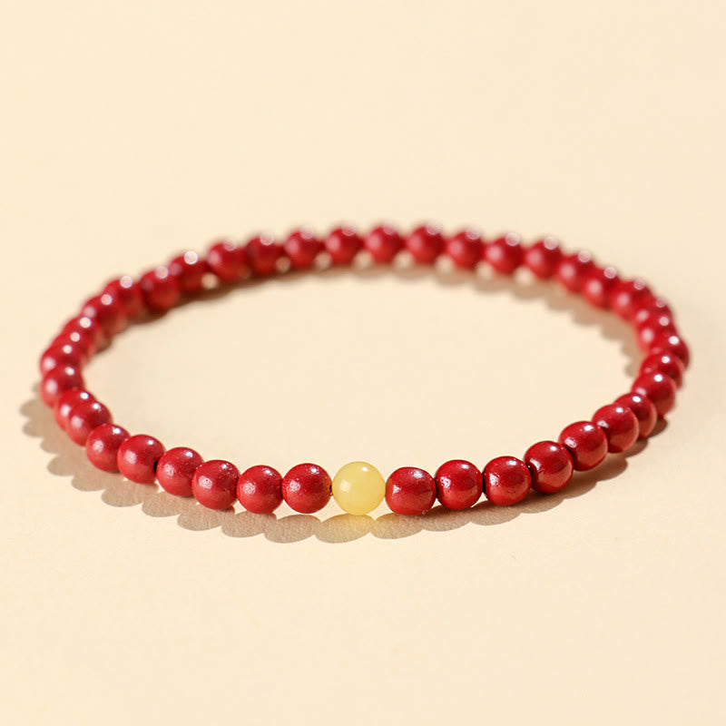 Natural Amber and Cinnabar Beaded Bracelet with Lotus Symbol