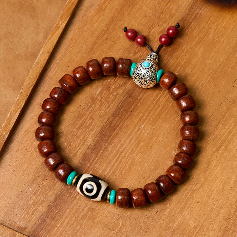 Handcrafted Bone Beads Bracelet with Three-Eyed Dzi and Vajra Elements