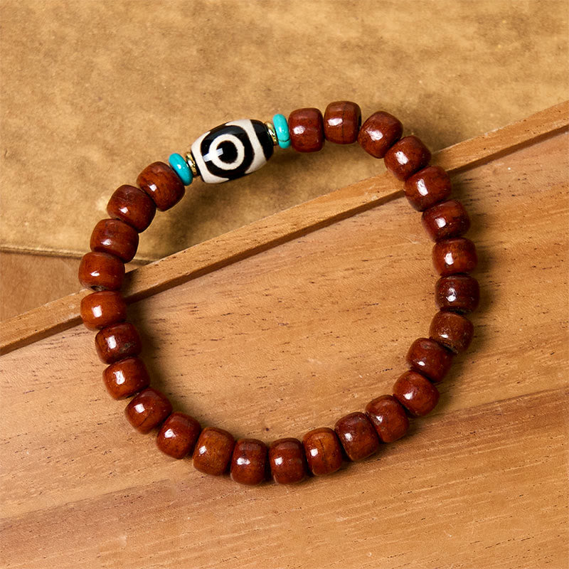 Handcrafted Bone Beads Bracelet with Three-Eyed Dzi and Vajra Elements
