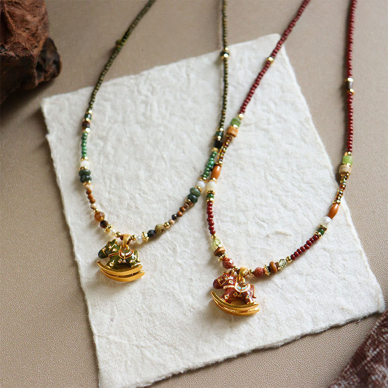 “Year of the Horse” Multi-Material Pendant Necklace with Copper, Green Garnet, Tiger Eye, Olive Wood, Pearl