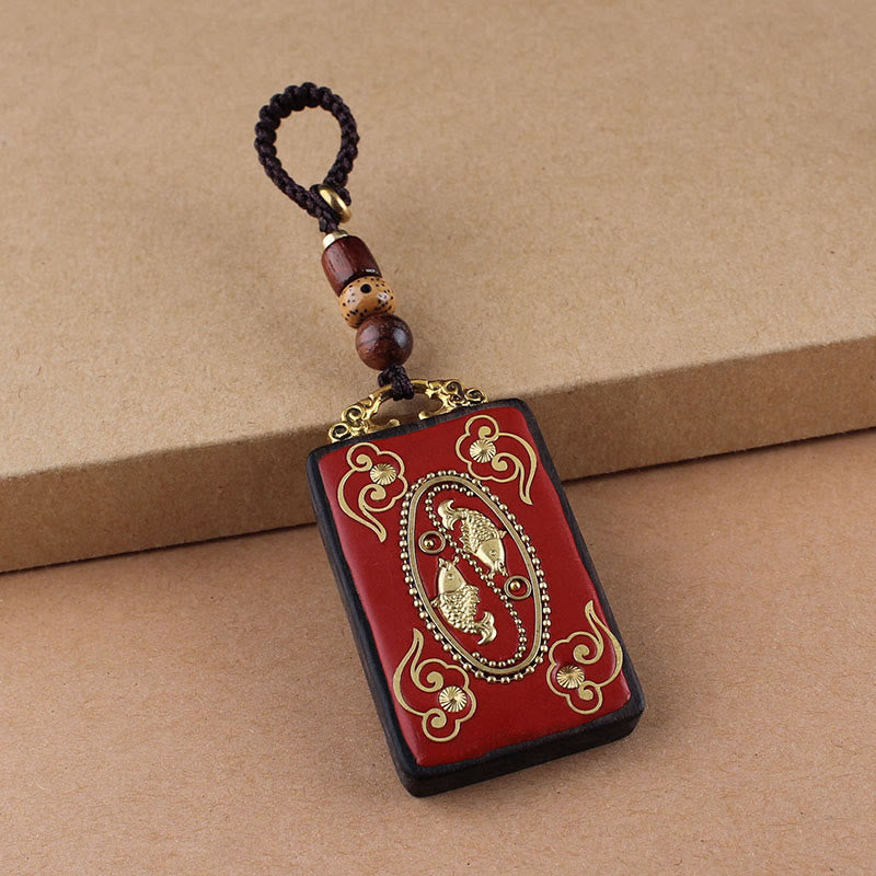 Hand-Carved Ebony Wood Red String Keyring with Symbolic Motifs