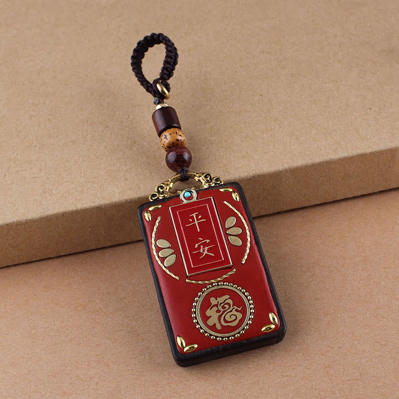 Hand-Carved Ebony Wood Red String Keyring with Symbolic Motifs