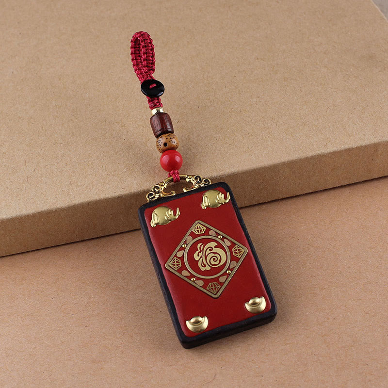 Hand-Carved Ebony Wood Red String Keyring with Symbolic Motifs