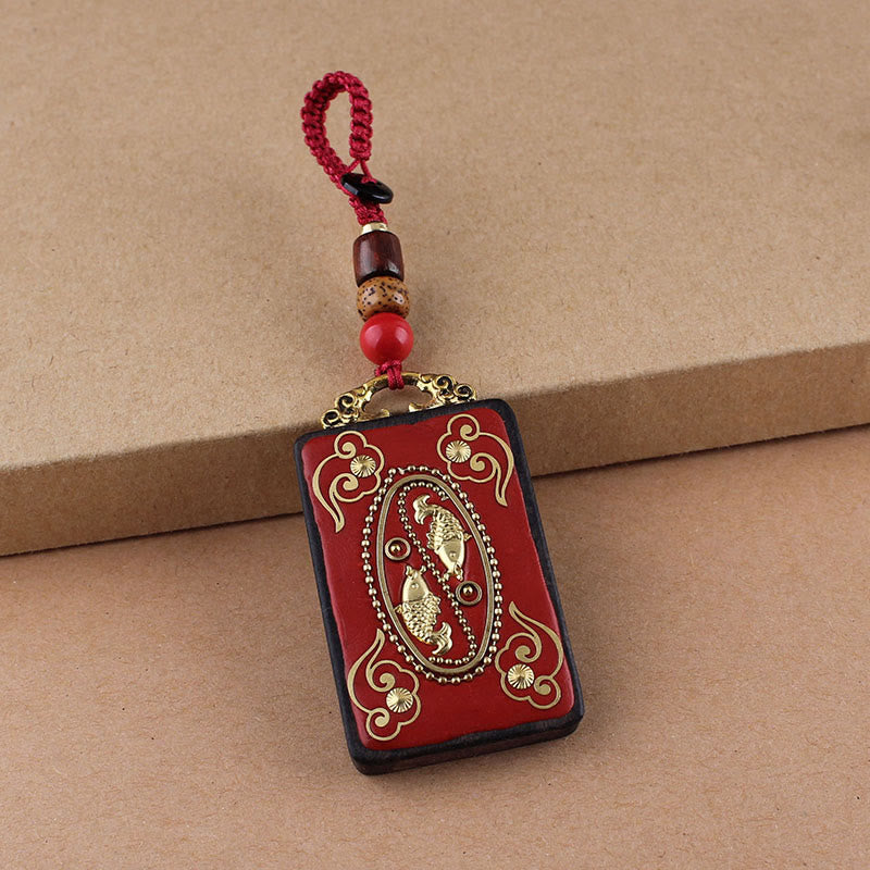 Hand-Carved Ebony Wood Red String Keyring with Symbolic Motifs