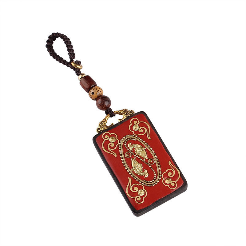 Hand-Carved Ebony Wood Red String Keyring with Symbolic Motifs