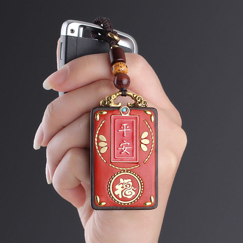 Hand-Carved Ebony Wood Red String Keyring with Symbolic Motifs