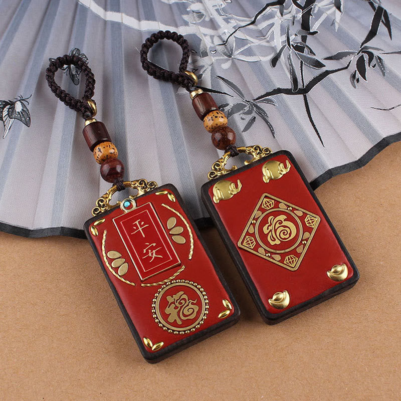 Hand-Carved Ebony Wood Red String Keyring with Symbolic Motifs