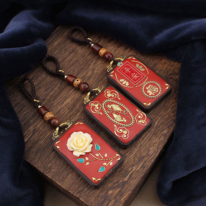 Hand-Carved Ebony Wood Red String Keyring with Symbolic Motifs