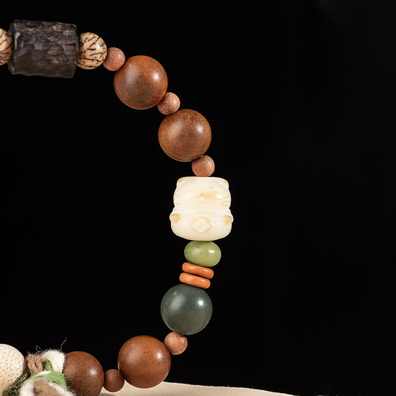 Lightning Struck Wood & Bodhi Seed Cat Paw Tassel Bracelet with Red Agate and Onyx