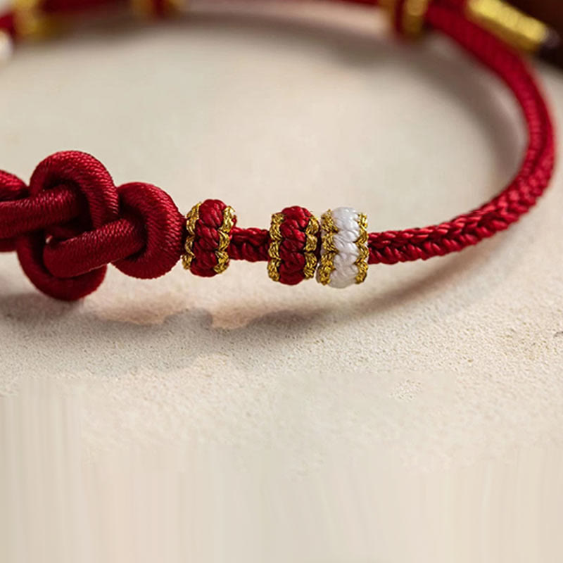 Hand-Braided Red String Bracelet with Copper Endless Knot & Peach Blossom Charm