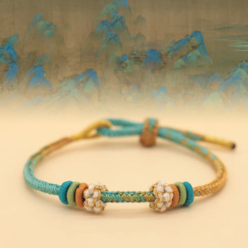 Handmade Eight-Thread Braided Endless Knot Bracelet with Peach Blossom Detail