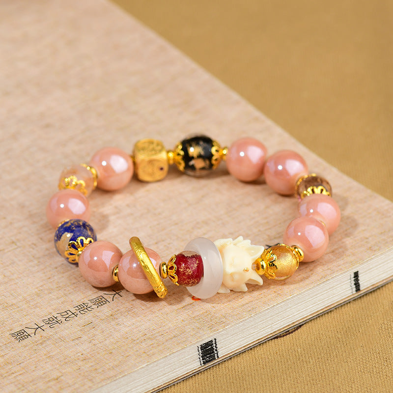 Artisanal Tibetan Incense Ash Liuli Glass Nine-Tailed Fox Charm Bracelet