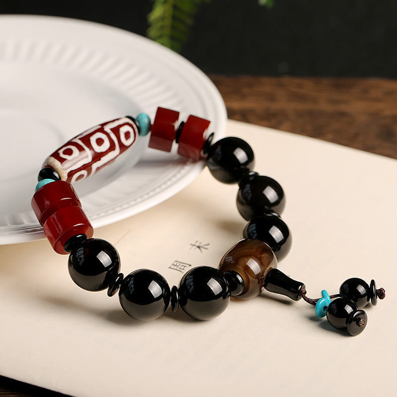 Tibetan Nine-Eye Dzi Bead and Polished Black Onyx Natural Stone Bracelet