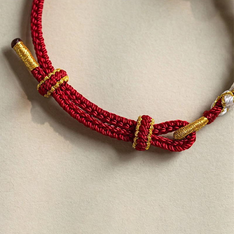 Hand-Braided Red String Bracelet with Copper Endless Knot & Peach Blossom Charm
