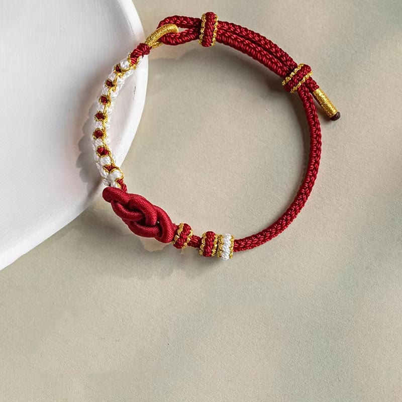 Hand-Braided Red String Bracelet with Copper Endless Knot & Peach Blossom Charm