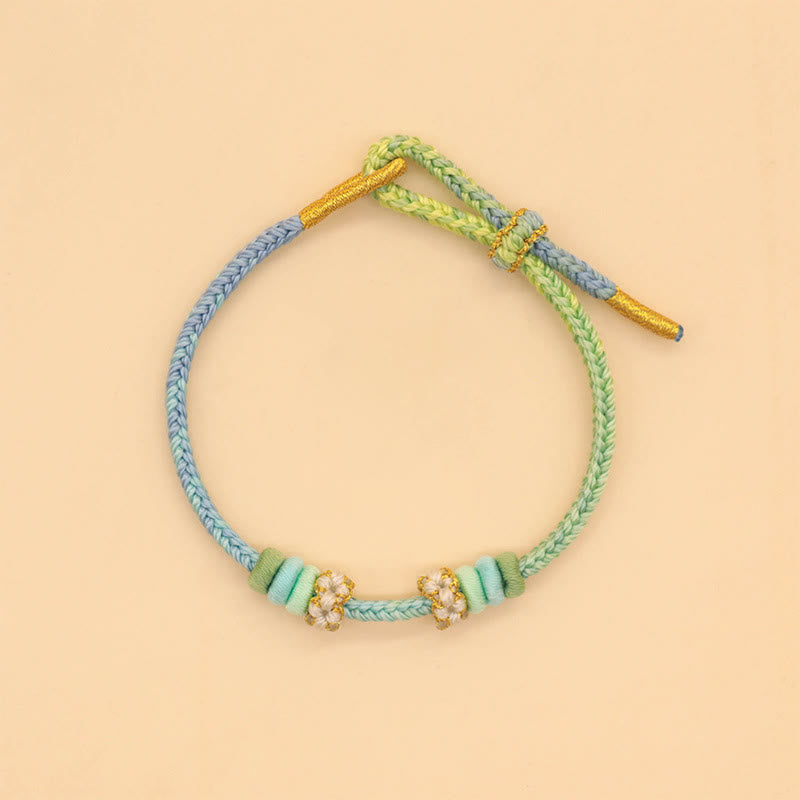 Handmade Eight-Thread Braided Endless Knot Bracelet with Peach Blossom Detail