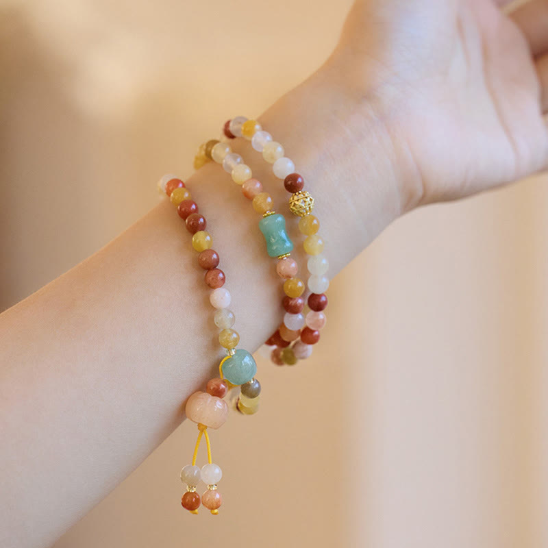 Natural Golden Silk Jade and Gold Plated Pumpkin Charm Triple Wrap Bracelet