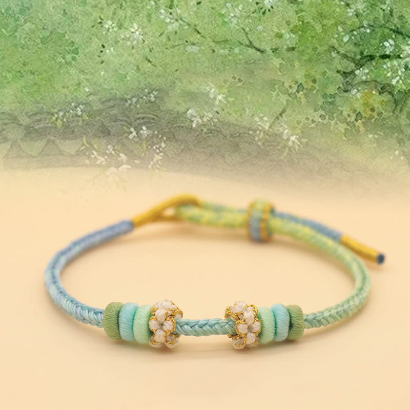 Handmade Eight-Thread Braided Endless Knot Bracelet with Peach Blossom Detail