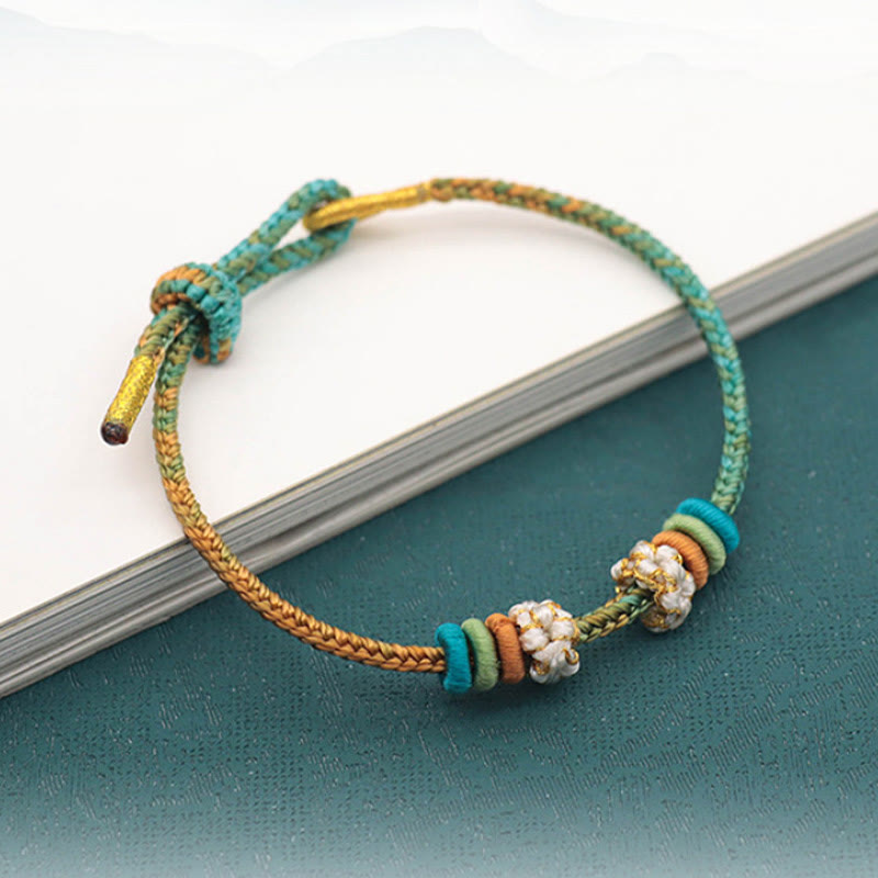 Handmade Eight-Thread Braided Endless Knot Bracelet with Peach Blossom Detail