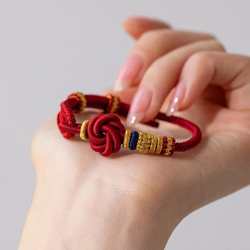 Hand-Braided Red String Bracelet with Copper Endless Knot & Peach Blossom Charm