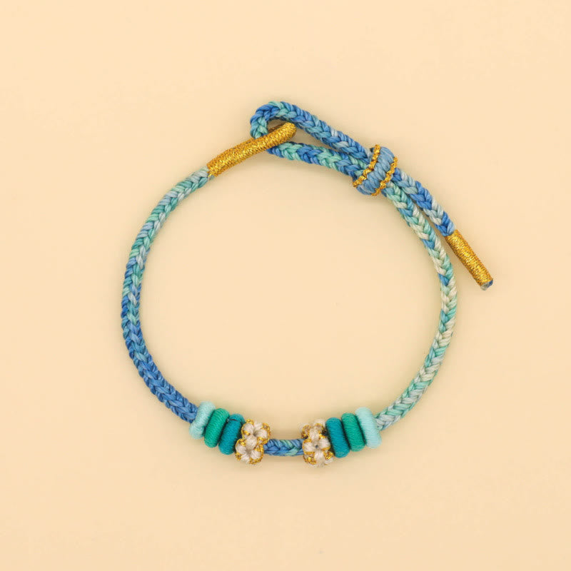 Handmade Eight-Thread Braided Endless Knot Bracelet with Peach Blossom Detail