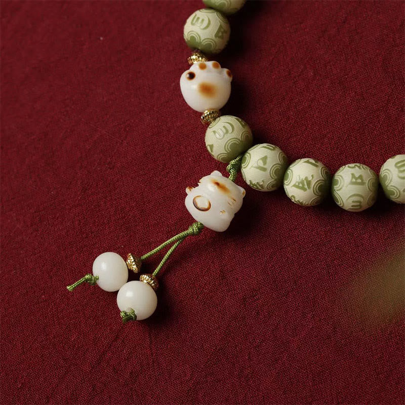 Green Bodhi Seed Om Mani Padme Hum Engraved Cat Paw Bracelet