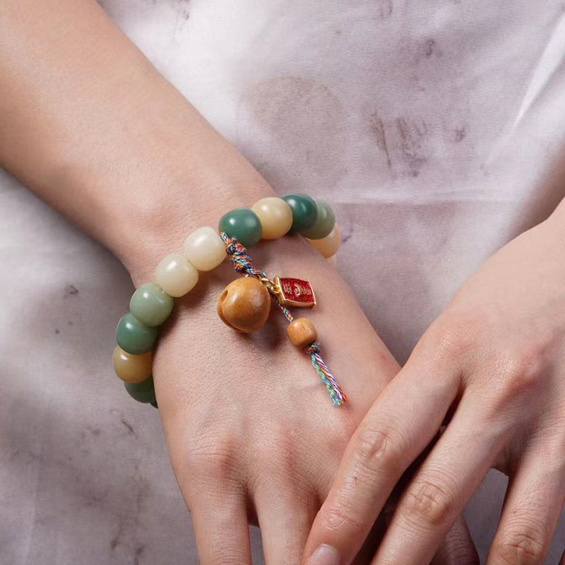 Natural Gradient Bodhi Seed Bracelet with Mokugyo Wooden Fish Charm